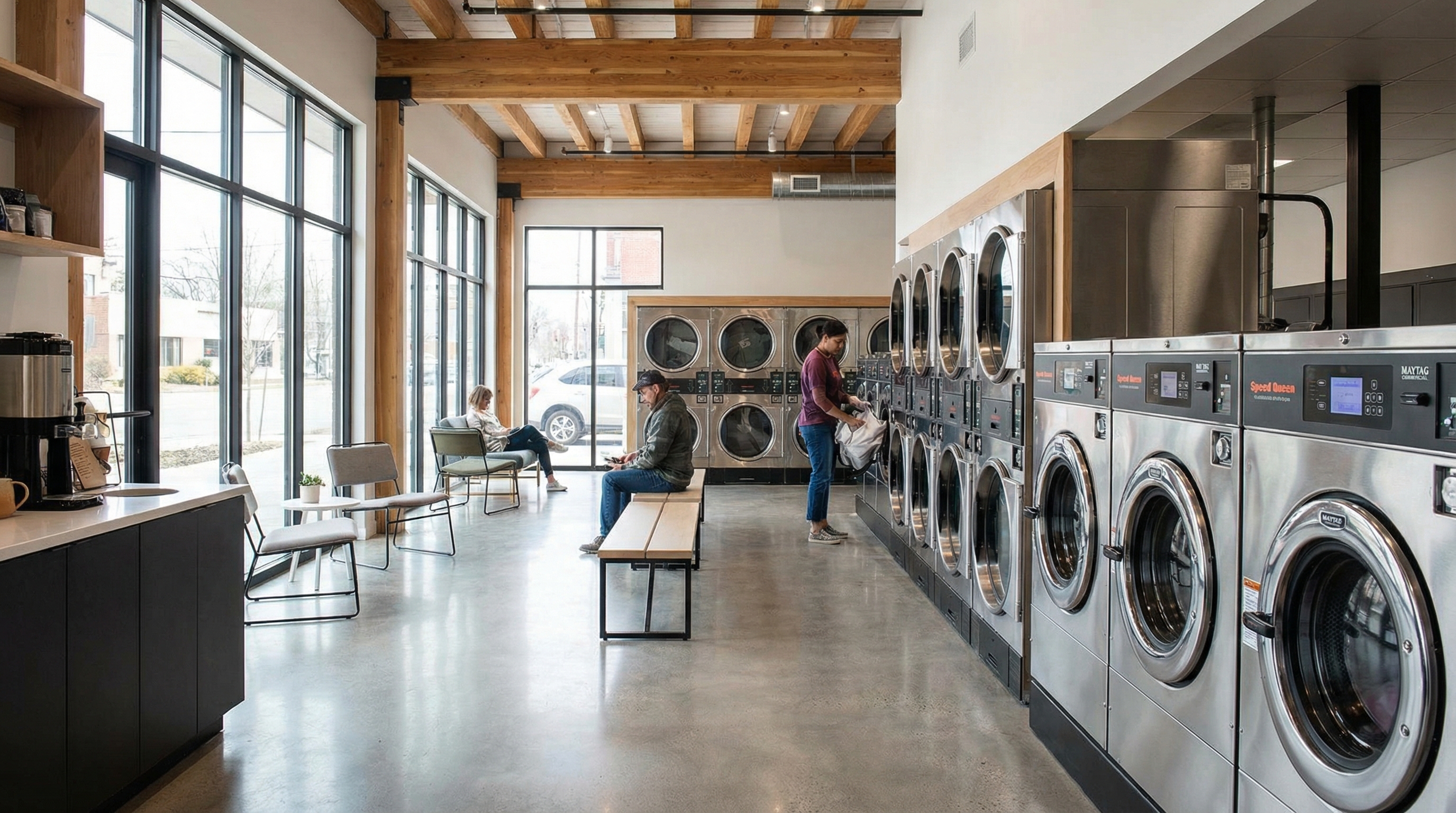 Commercial laundry equipment in a modern laundromat with washers and dryers