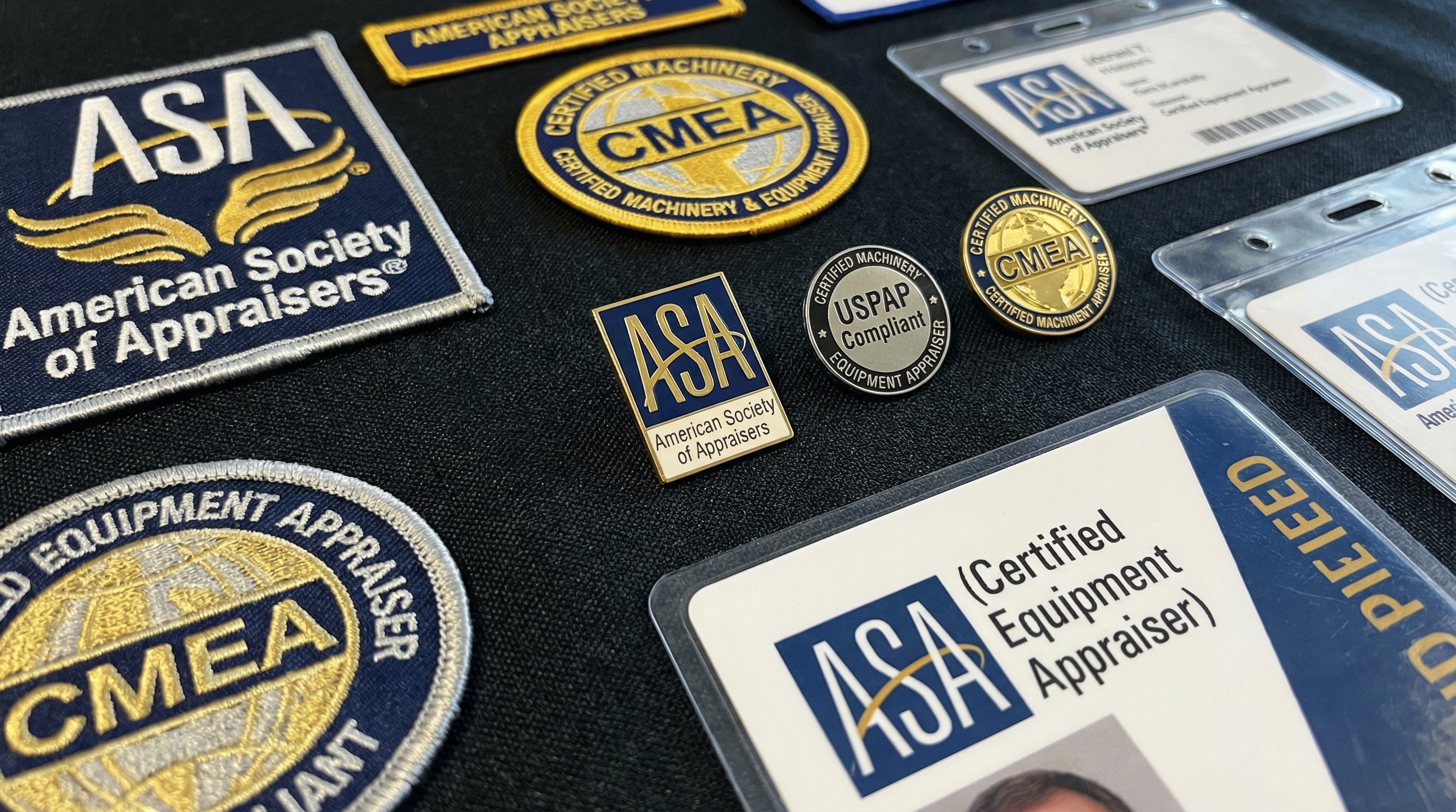 close-up of professional certification badges and credentials for equipment appraisers
