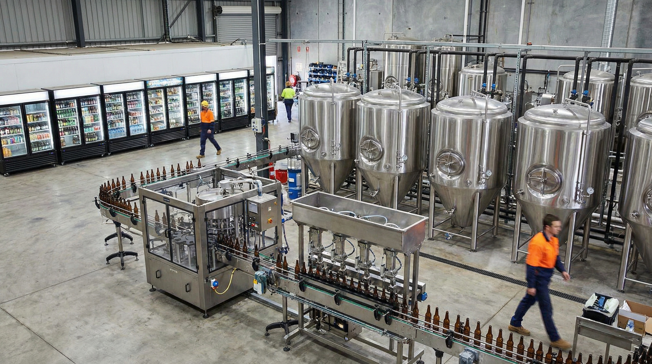 Various beverage equipment including bottling line, commercial refrigeration, and brewing tanks