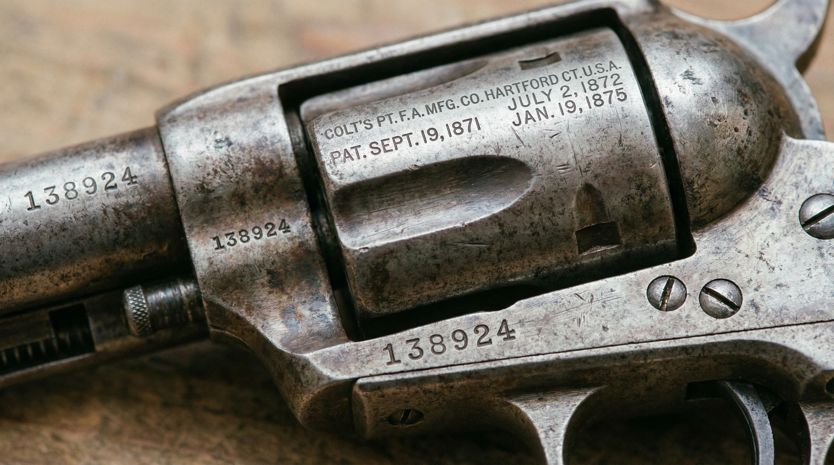 Detailed close-up shots of antique gun markings, serial numbers and condition details