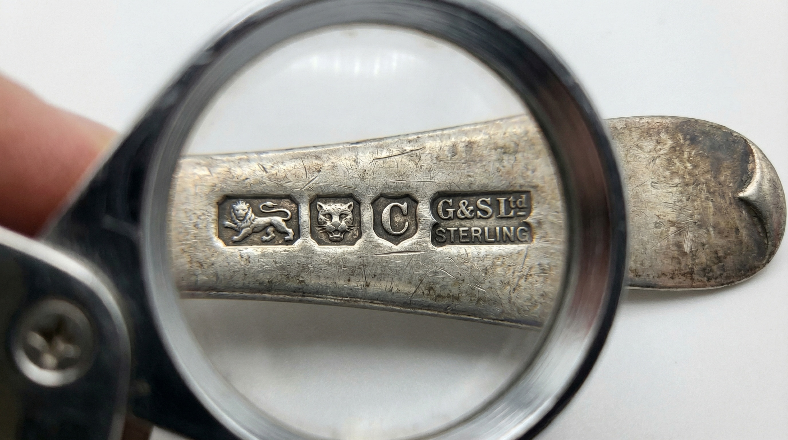 silver hallmark magnification showing sterling marks