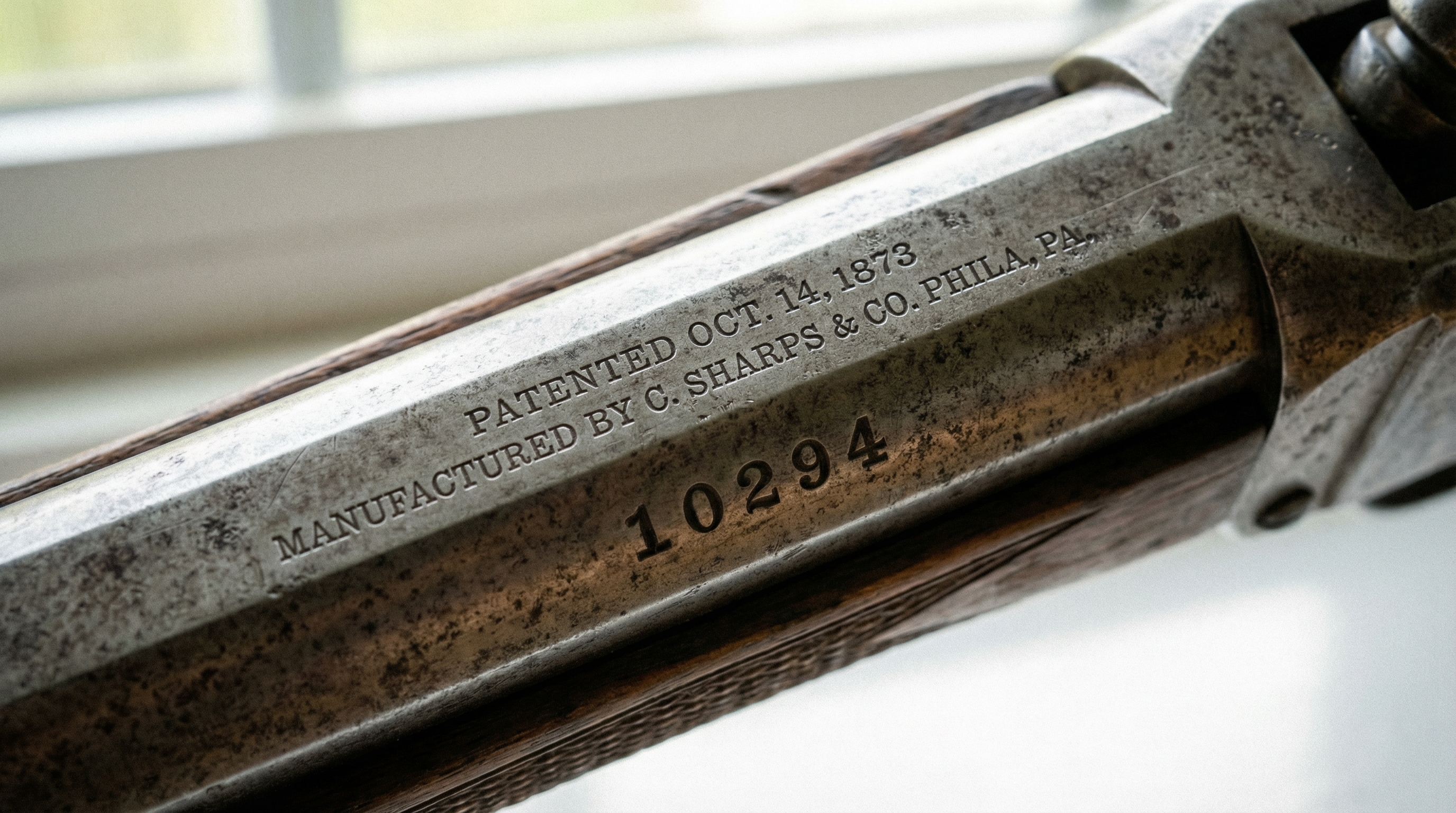 Close-up of antique gun markings and serial numbers
