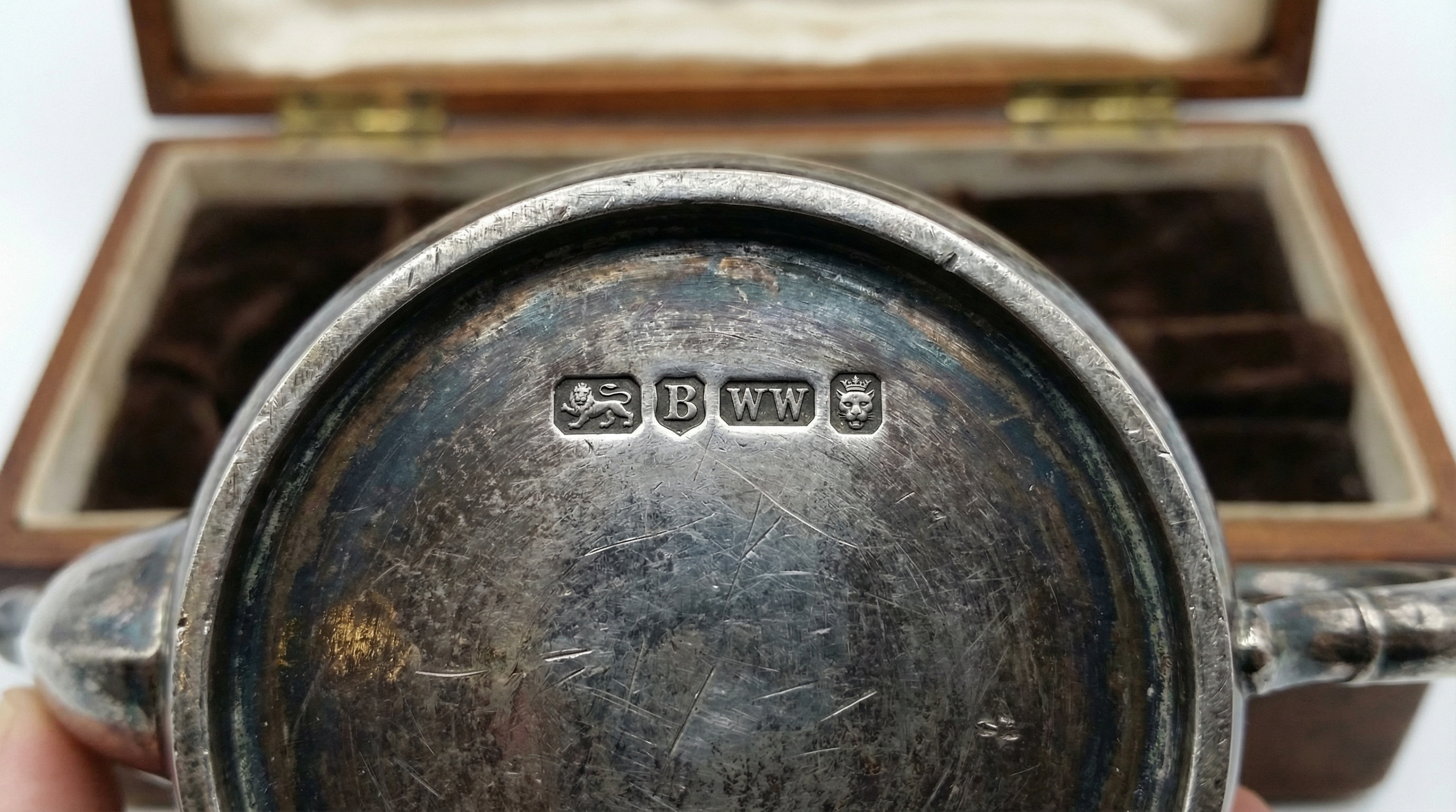 Antique silver tea set with hallmarks close-up